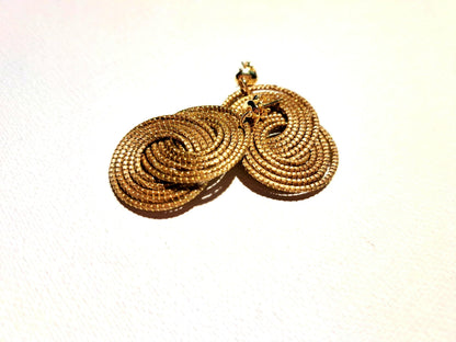 Boucles d’oreilles à grandes spirales entrelacées en Capim Dourado