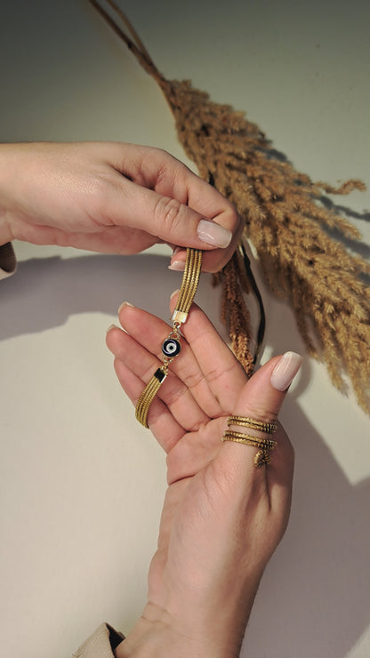 Bracciale con occhio greco blu in Capim Dourado, gioiello artigianale brasiliano