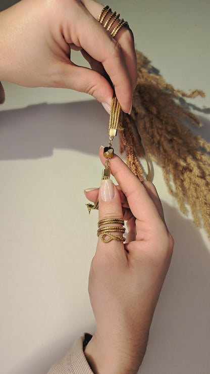 Bracciale in Capim Dourado (oro vegetale del Brasile), con pietra centrale marrone
