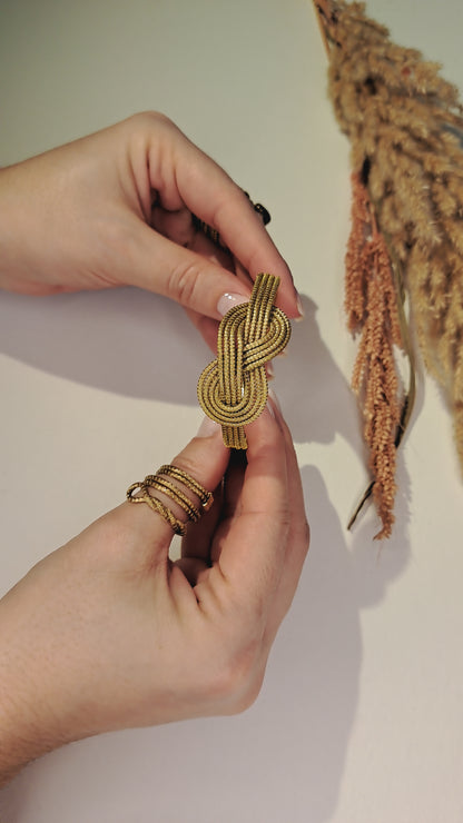 Bracciale con motivo infinito in Capim Dourado, gioiello simbolo di eternità