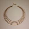 Collier artisanal en capim dourado, l’or végétal du Brésil